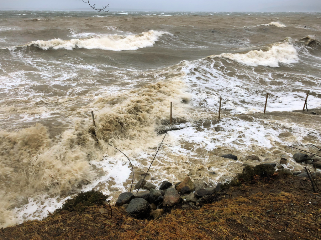 Image of storm at high tide on the retaining wall