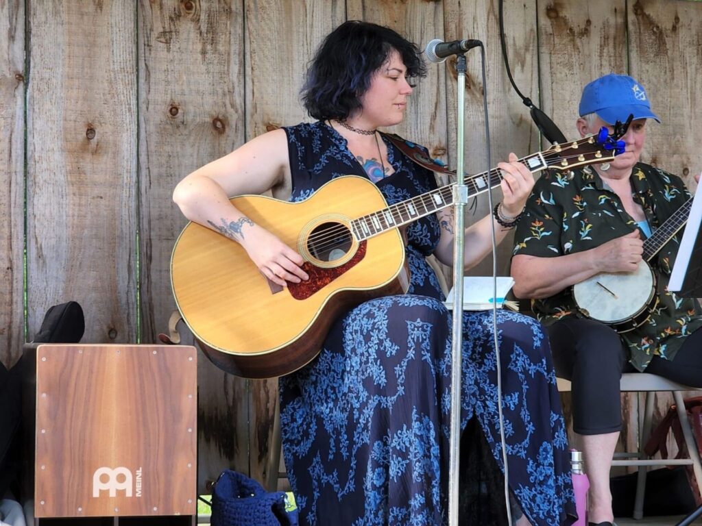 woman playing guitar