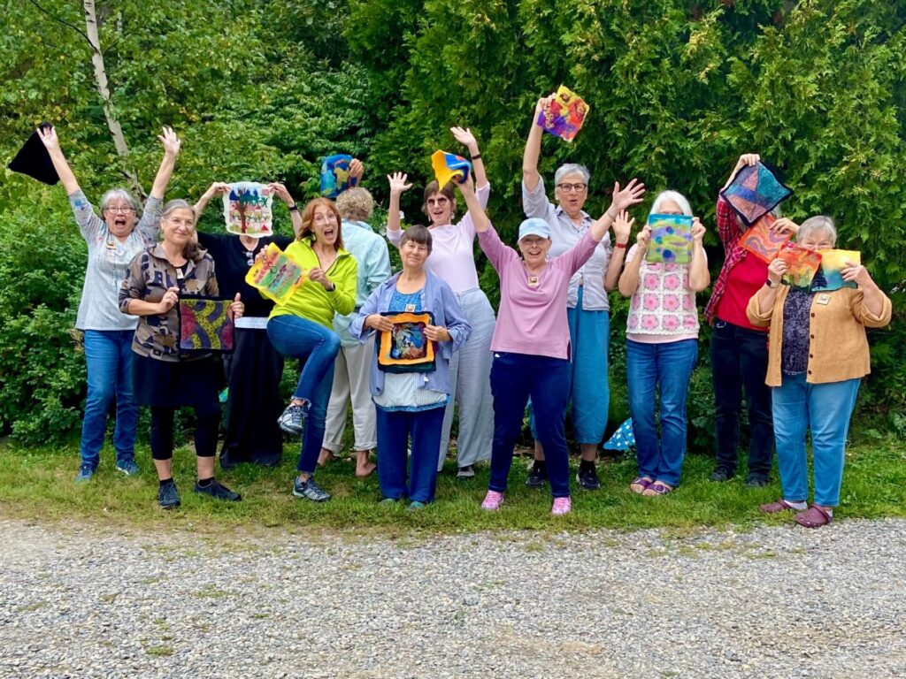 group of people showing their artwork