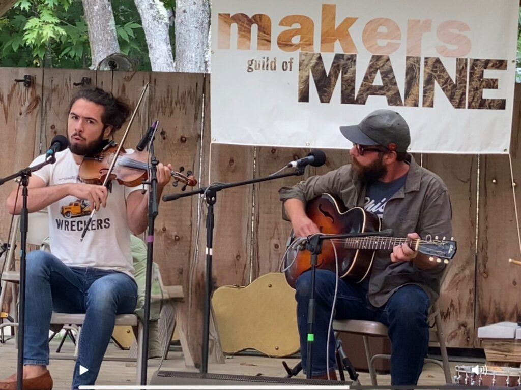 two men performing on stage