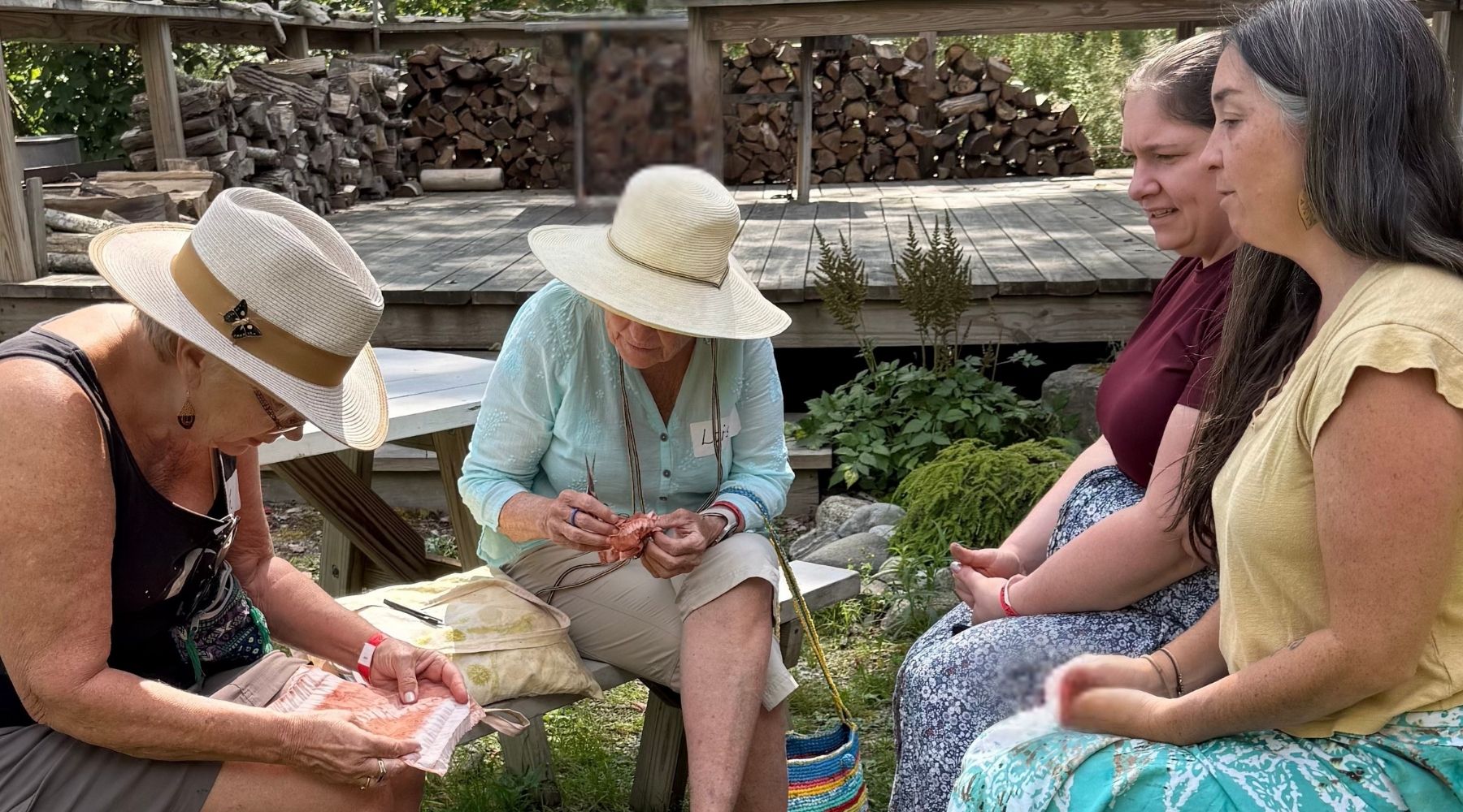 women stitching in the garden